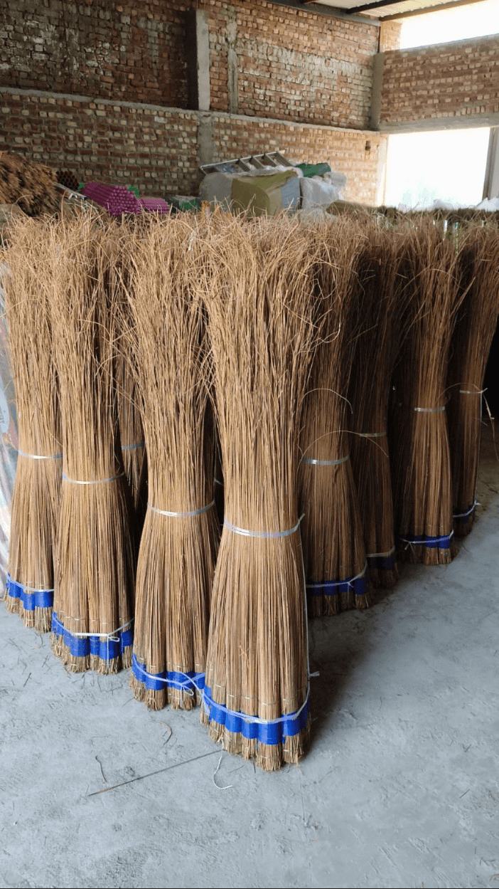 Natural broom grass bundles at the Devyansh workshop